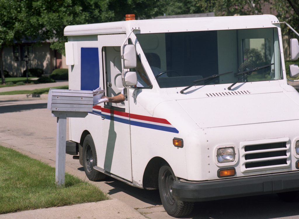 USPS worker delivering mail after customer received an 'out for delivery' alert