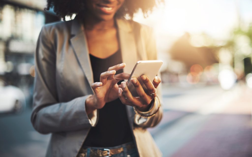 Woman checks a deadline reminder on her mobile phone